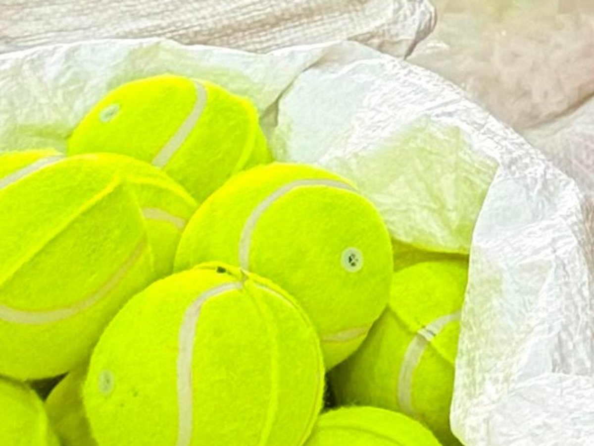 Close-up of finished yellow tennis balls